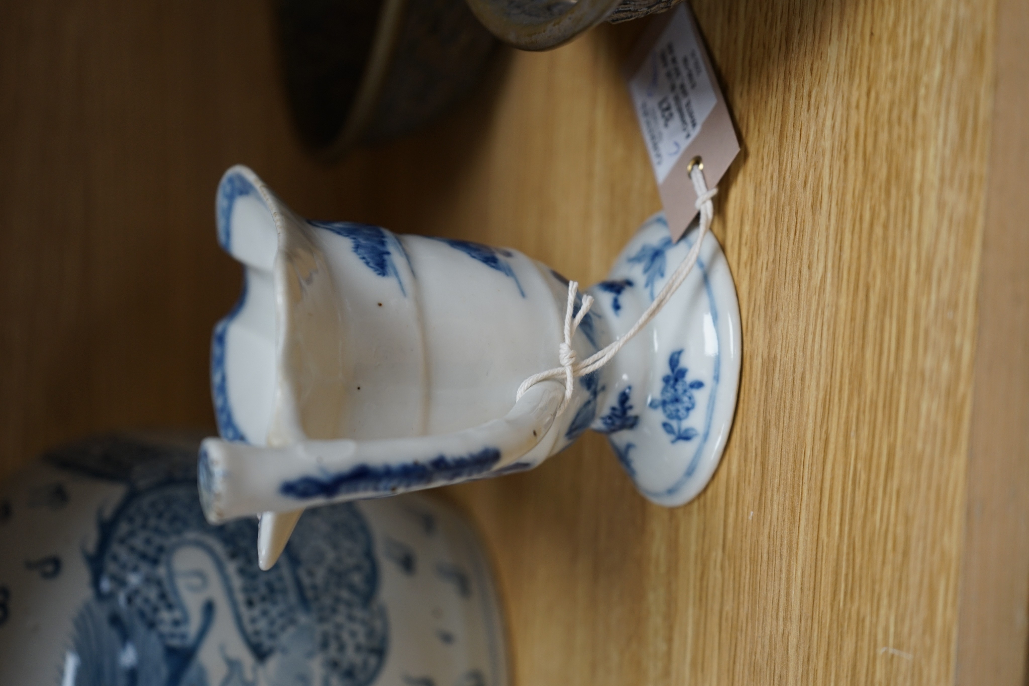 A Chinese blue and white jar, 20cm and a helmet shaped jug, 18th century and later